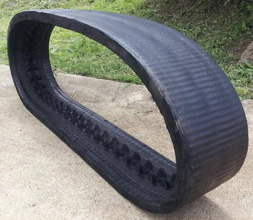 Mini skid steer tracks retreaded with a smooth tread